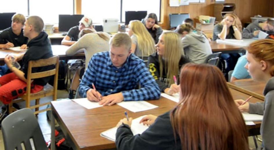 A classroom of kids working on desks