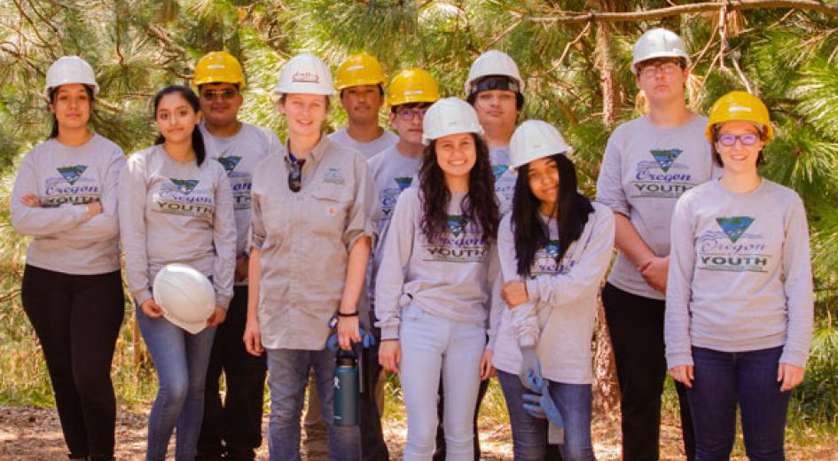 A group of kids with hard hats on